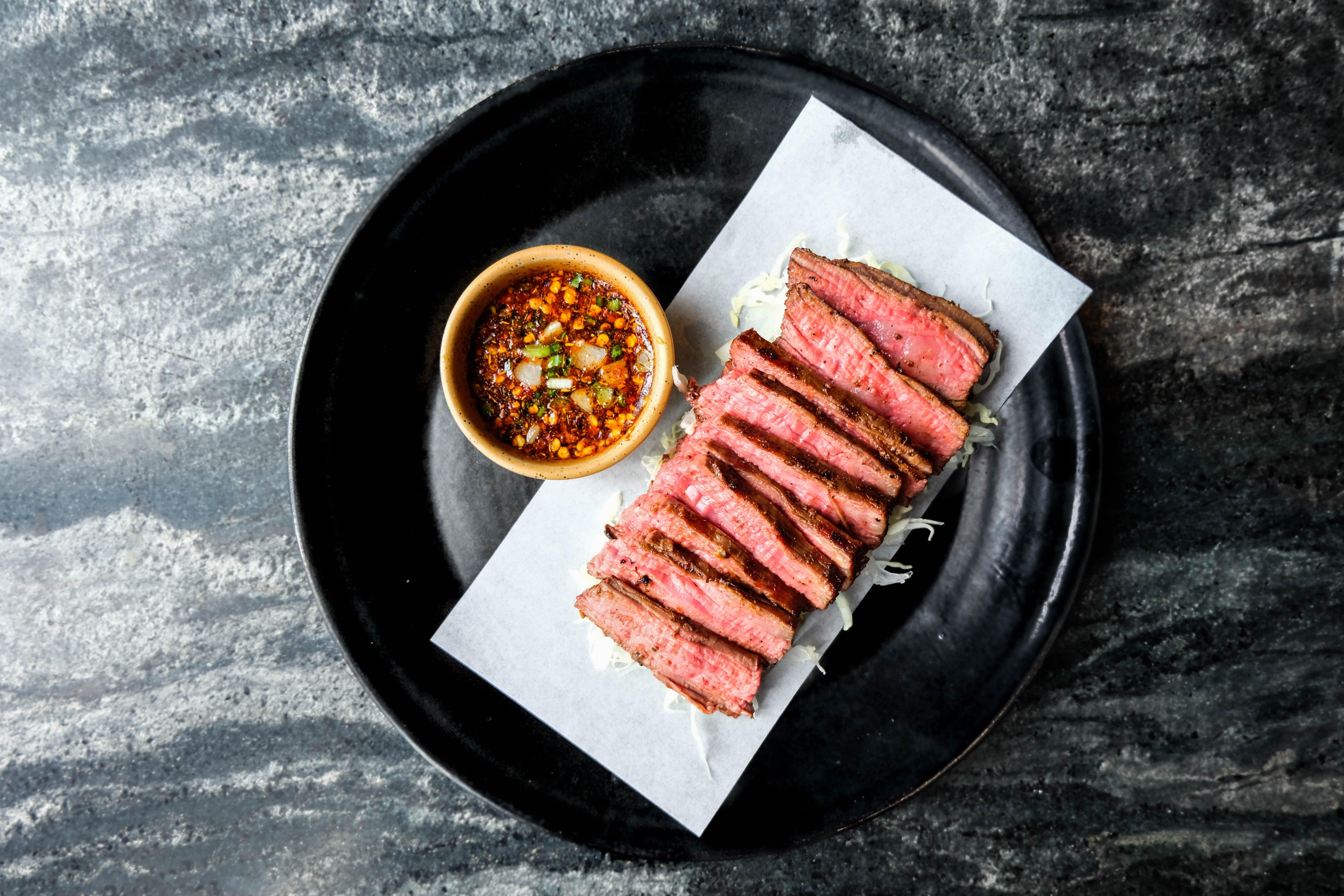 Hotel Indigo Bangkok Wireless Road By Ihg Kültér fotó A plate of grilled steak